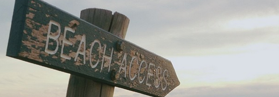 Beach access sign post